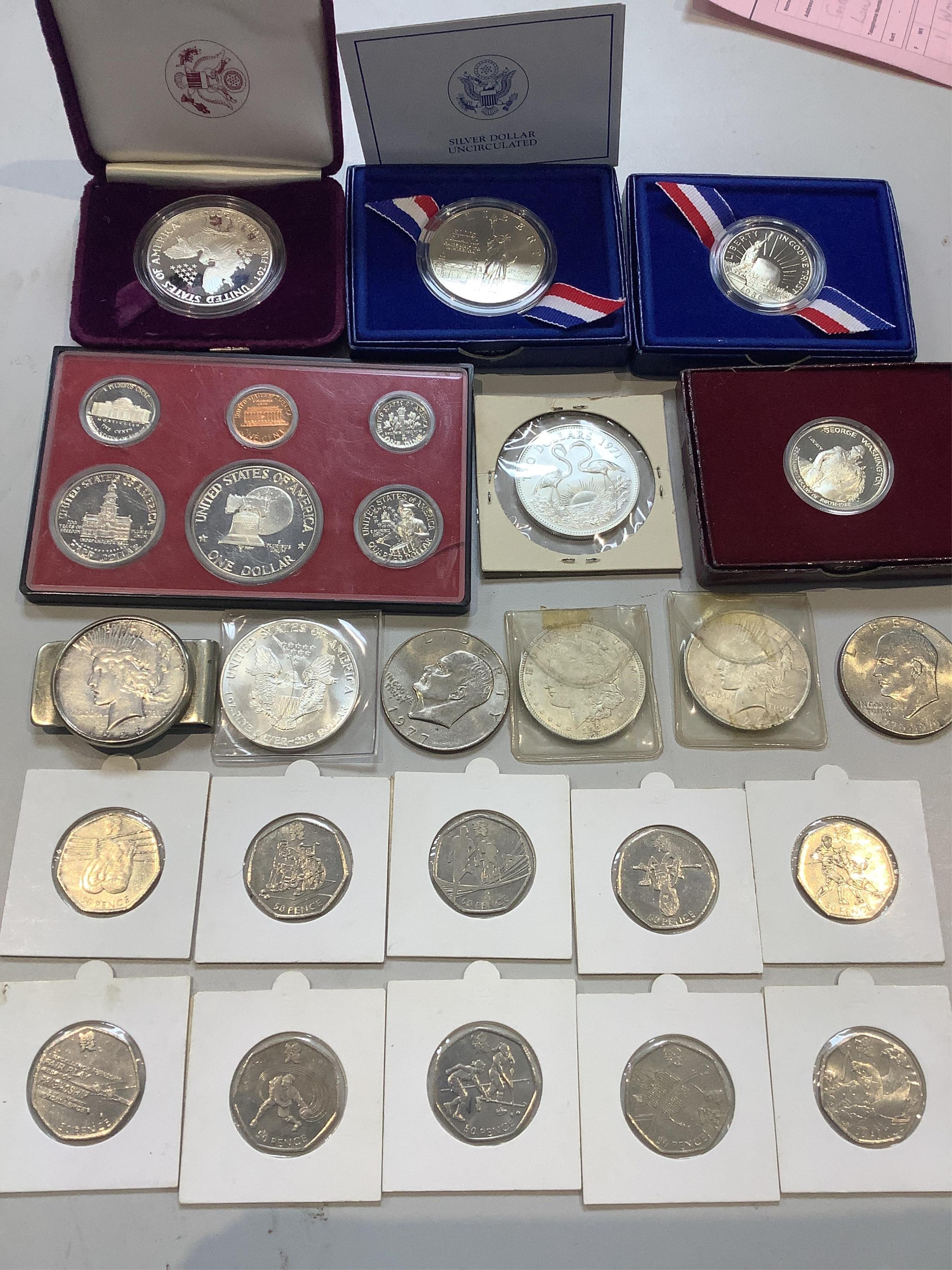 British and USA coins, including various silver dollars and presentation sets and a large number of QEII 50p coins many with 2011/12 Olympic designs, etc.